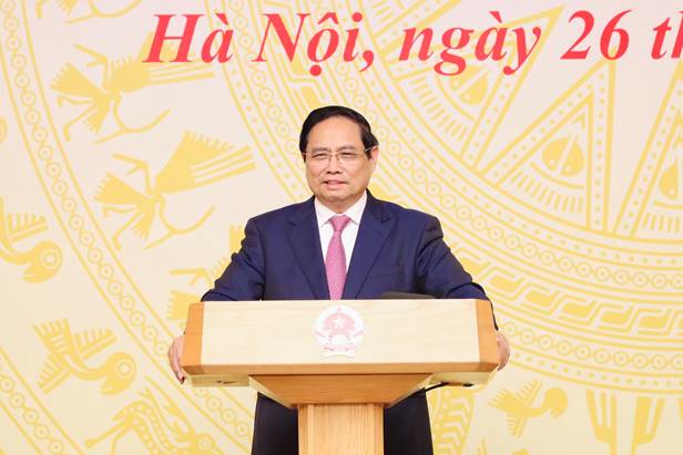 A person standing at a podium  Description automatically generated