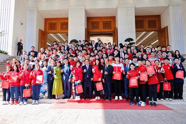 A group of people posing for a photo  Description automatically generated