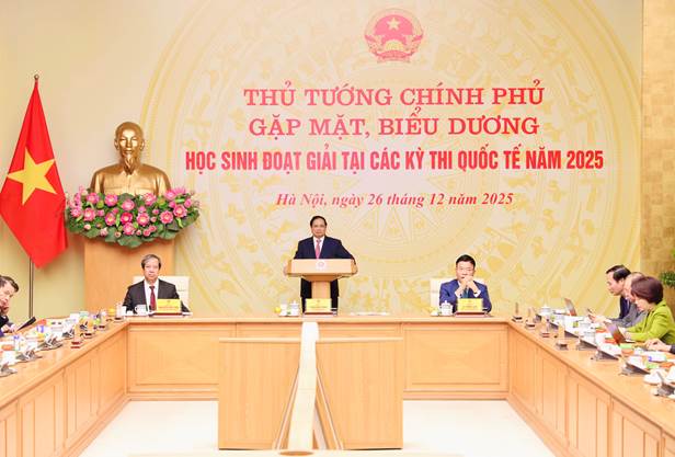 A group of people sitting at a podium  Description automatically generated