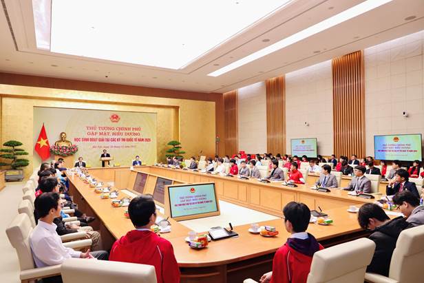 A group of people in a meeting  Description automatically generated