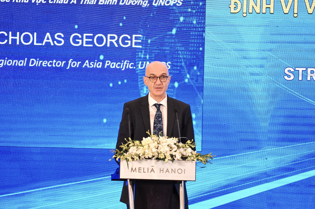 A person standing at a podium with flowers

AI-generated content may be incorrect.