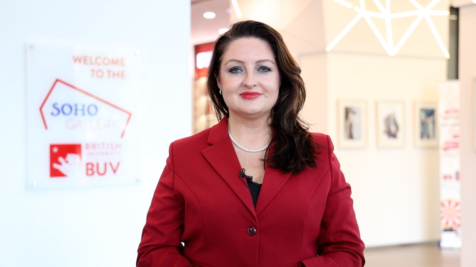 A person in a red suit  Description automatically generated